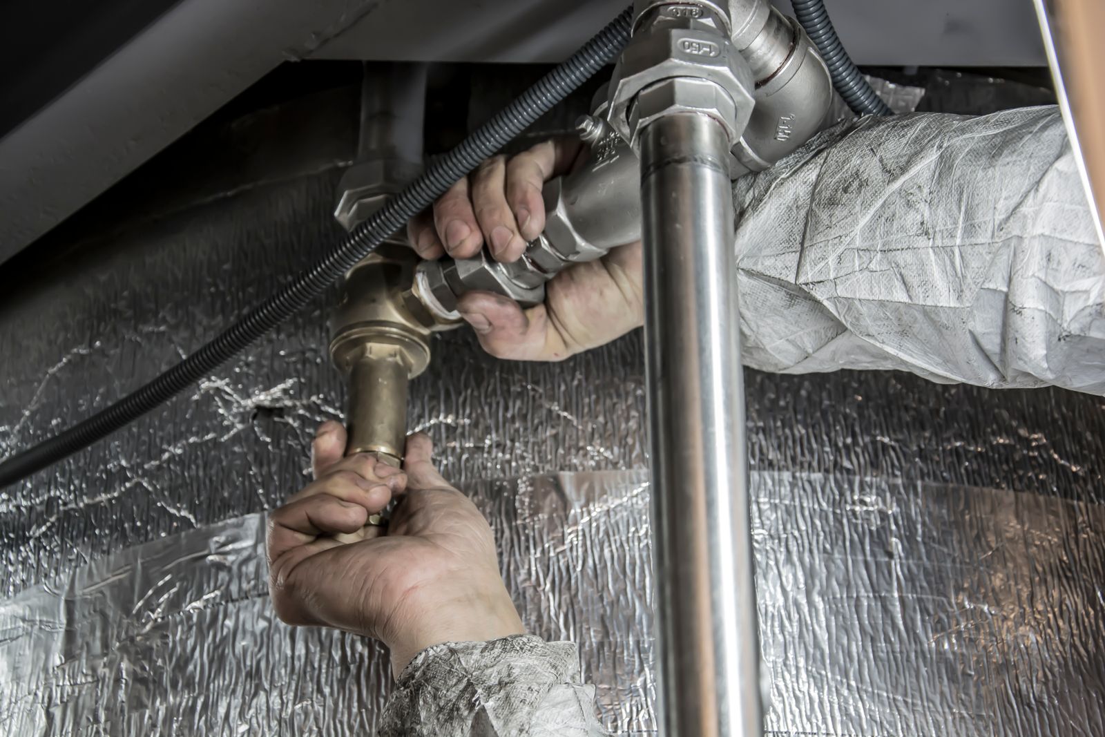 Brian Bickford installing commercial plumbing pipe fittings